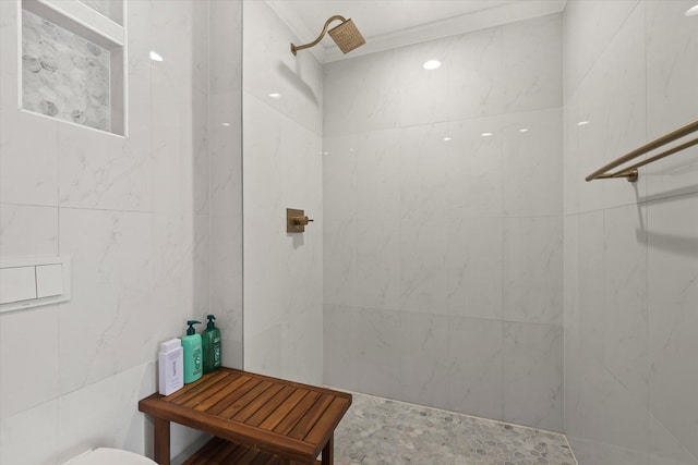 bathroom with tiled shower