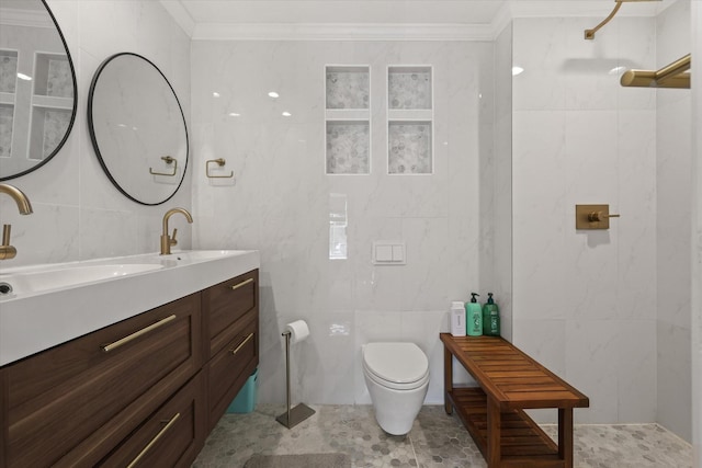 bathroom featuring tile walls, vanity, and ornamental molding