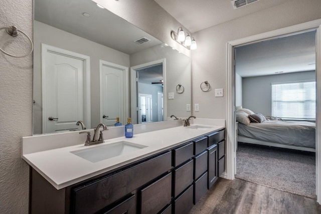 bathroom featuring vanity and hardwood / wood-style floors