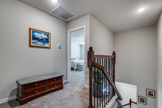 hallway with carpet flooring