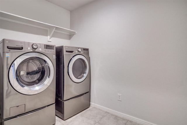 clothes washing area featuring washing machine and clothes dryer