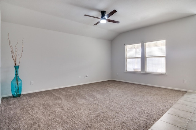 unfurnished room featuring lofted ceiling, light tile patterned floors, and ceiling fan