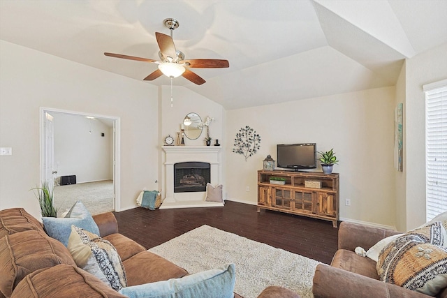 living room with ceiling fan, lofted ceiling, and dark hardwood / wood-style flooring