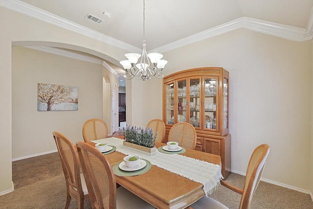 carpeted dining space featuring an inviting chandelier, ornamental molding, and lofted ceiling