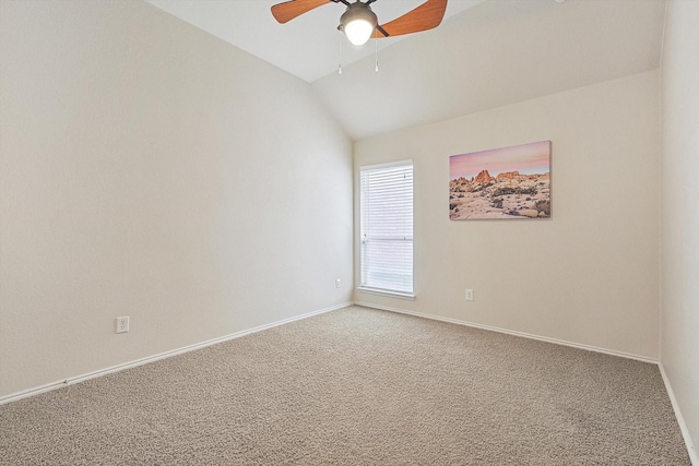 carpeted empty room with ceiling fan and lofted ceiling