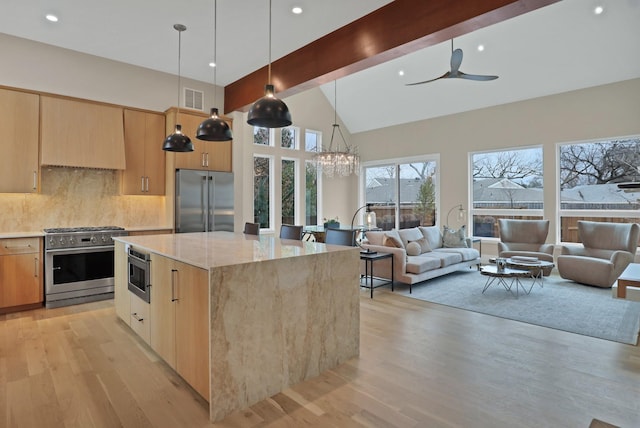 kitchen featuring visible vents, light wood-style flooring, modern cabinets, and high end appliances