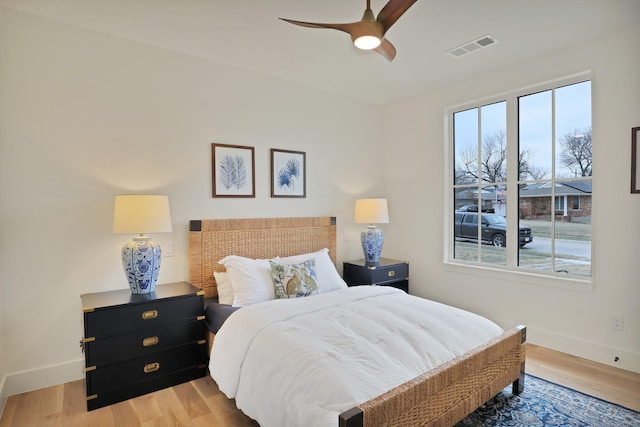 bedroom with light hardwood / wood-style flooring and ceiling fan