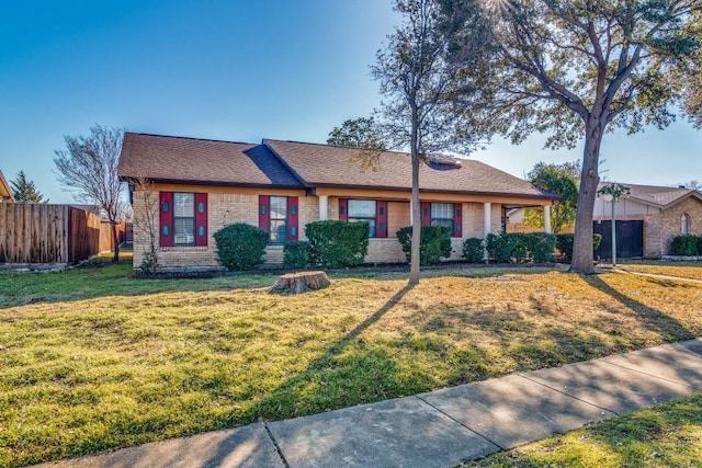 ranch-style home with a front lawn