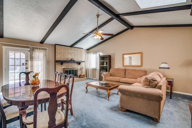 living room featuring a healthy amount of sunlight, a brick fireplace, carpet floors, and vaulted ceiling with beams