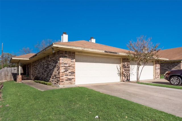 view of front of house with a garage and a front yard