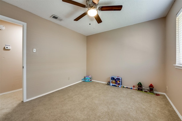 game room featuring ceiling fan and carpet