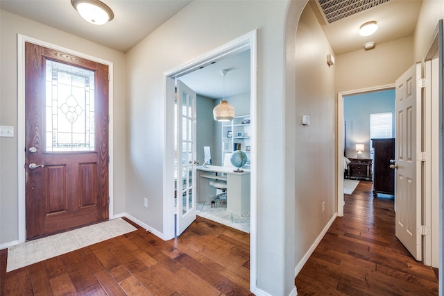 foyer with dark wood-type flooring