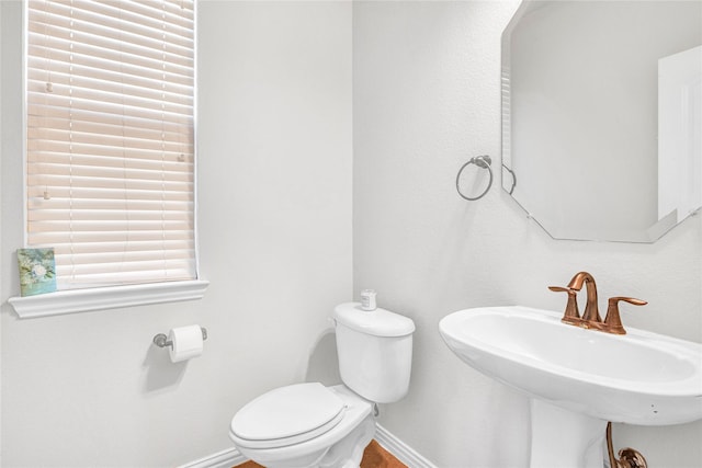 bathroom featuring toilet and sink