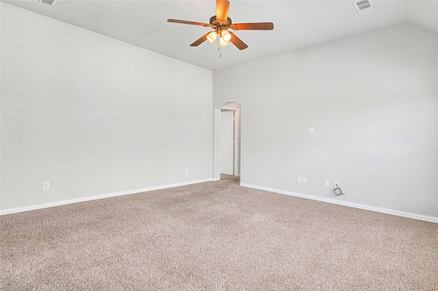 carpeted spare room with vaulted ceiling and ceiling fan