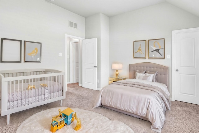 bedroom featuring lofted ceiling and carpet