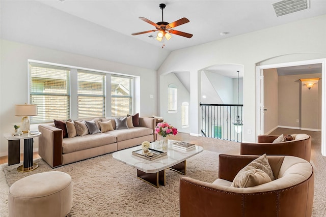 carpeted living room featuring lofted ceiling and ceiling fan