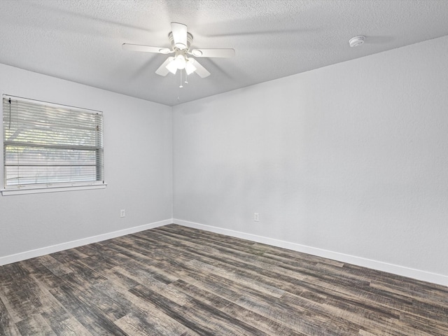 spare room featuring dark hardwood / wood-style floors, a textured ceiling, and ceiling fan