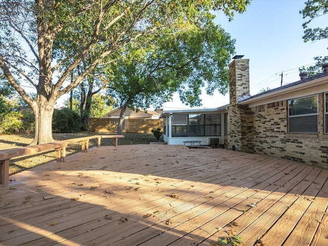 deck with a sunroom