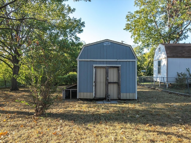 view of outbuilding with a lawn