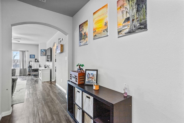 hallway with hardwood / wood-style flooring