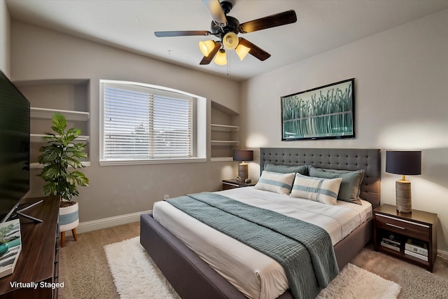 carpeted bedroom featuring ceiling fan