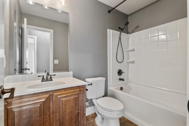 full bathroom with vanity, tile patterned floors, toilet, and washtub / shower combination