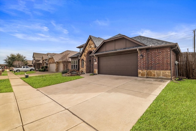 view of front of house featuring a garage and a front yard