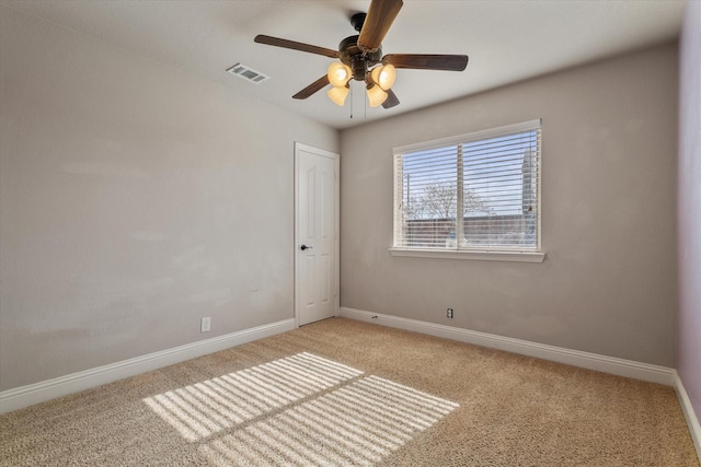 carpeted empty room with ceiling fan