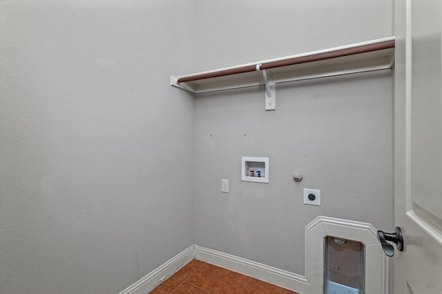 clothes washing area featuring electric dryer hookup, hookup for a washing machine, hookup for a gas dryer, and tile patterned flooring