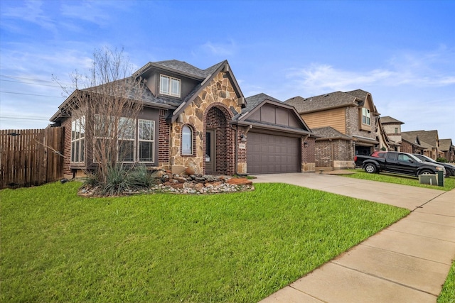 view of front of property with a garage and a front yard