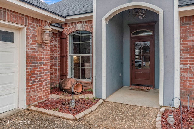 doorway to property featuring a garage