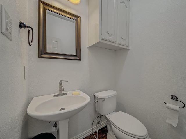 bathroom featuring toilet