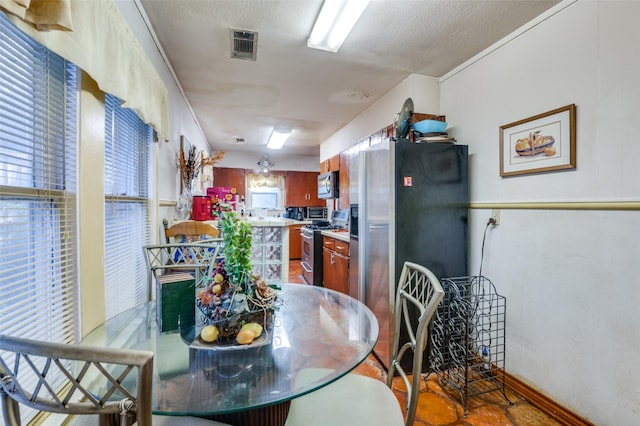 dining area with a textured ceiling