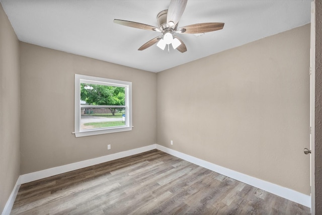 empty room featuring light hardwood / wood-style floors and ceiling fan