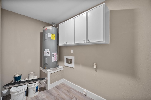 laundry room with cabinets, light wood-type flooring, hookup for a washing machine, electric water heater, and electric dryer hookup