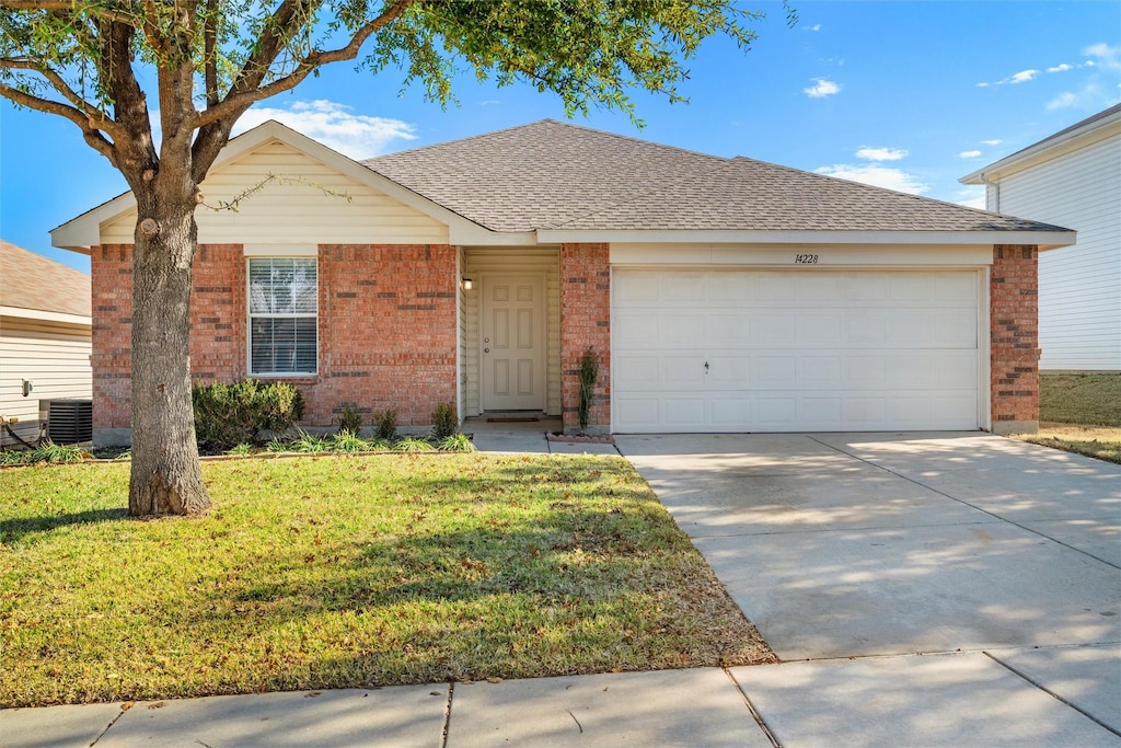 ranch-style home with cooling unit, a garage, and a front yard