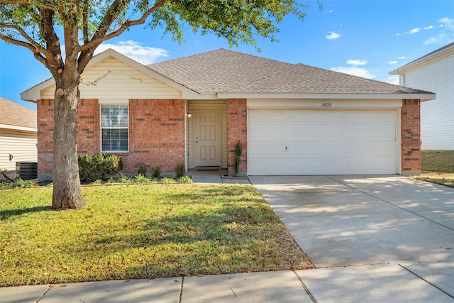 ranch-style home with cooling unit, a garage, and a front yard