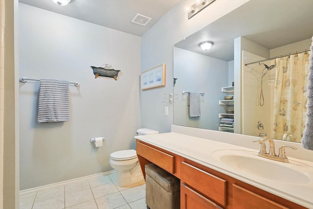 bathroom with vanity, tile patterned floors, and toilet