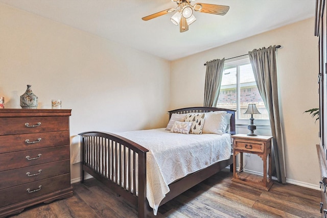 bedroom featuring ceiling fan and dark hardwood / wood-style floors