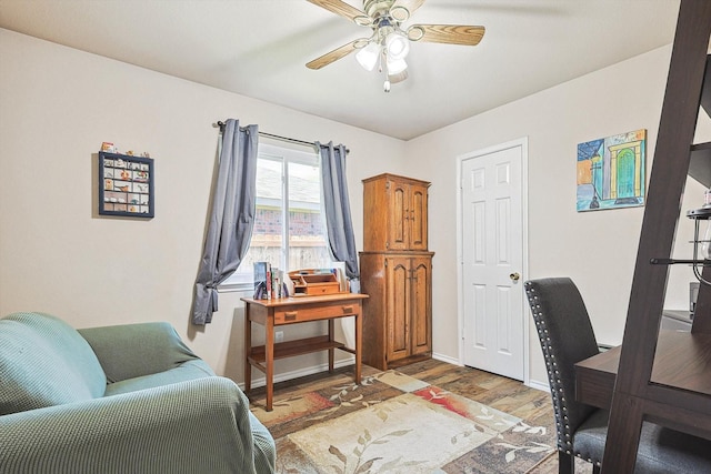 office space with wood-type flooring and ceiling fan