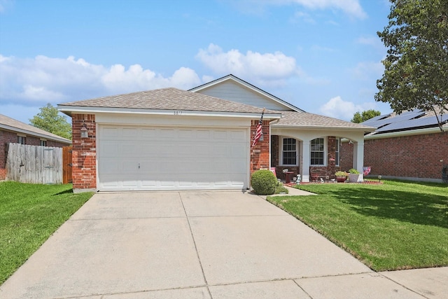 ranch-style home featuring a garage and a front lawn