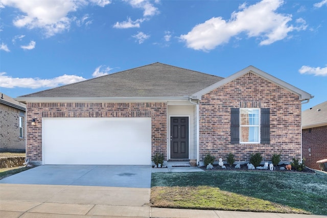 ranch-style house featuring a garage and a front lawn