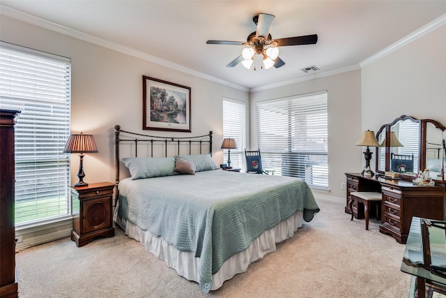 carpeted bedroom with crown molding and ceiling fan