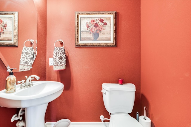 bathroom with sink and toilet