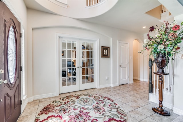 tiled entryway with french doors