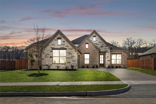 view of front of property with a yard