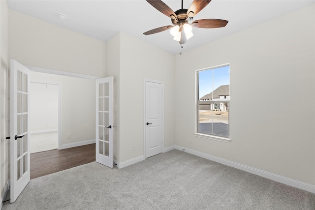 unfurnished bedroom with carpet, ceiling fan, and french doors