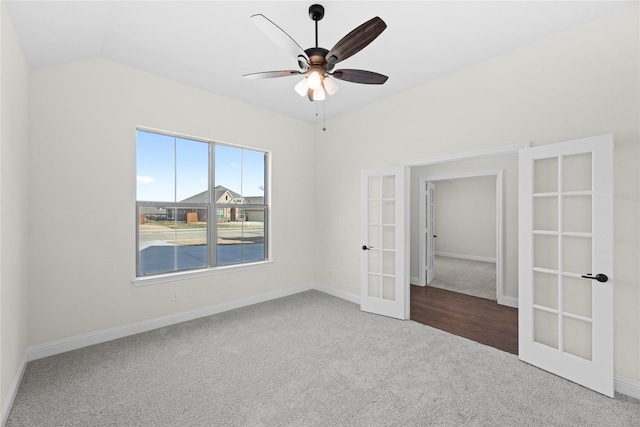 unfurnished bedroom with lofted ceiling, carpet floors, ceiling fan, and french doors