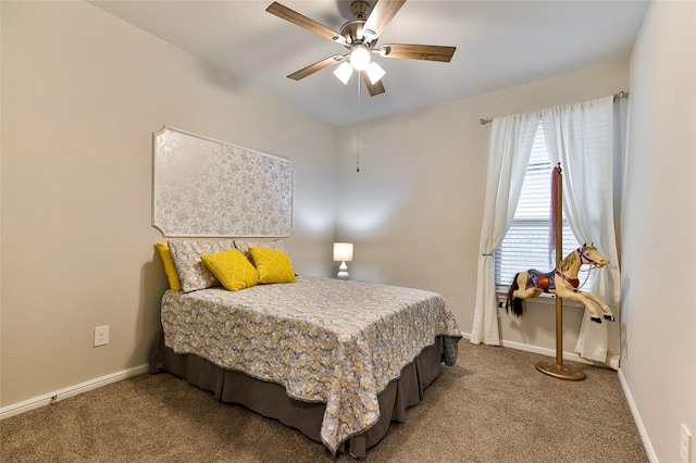 carpeted bedroom with baseboards and ceiling fan