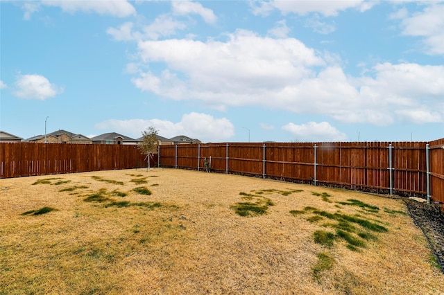 view of yard featuring a fenced backyard